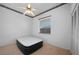 This bedroom includes a ceiling fan, closet, and natural light from a window at 341 Segovia Dr, Punta Gorda, FL 33950
