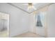 A carpeted bedroom with natural light from a window and light colored curtains at 341 Segovia Dr, Punta Gorda, FL 33950