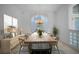 Bright dining room featuring a chandelier over a wooden table and seating for six at 341 Segovia Dr, Punta Gorda, FL 33950
