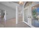 Bright foyer featuring tiled floors, a decorative chandelier, and an open view into the living spaces at 341 Segovia Dr, Punta Gorda, FL 33950