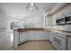 Bright kitchen with tiled floors and stainless steel appliances overlooking waterfront view at 341 Segovia Dr, Punta Gorda, FL 33950