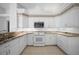 Traditional kitchen with white cabinets, granite countertops, and tile flooring at 341 Segovia Dr, Punta Gorda, FL 33950