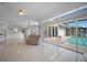 Open floor plan boasts a seamless flow to the pool area with a modern kitchen and airy ambiance at 341 Segovia Dr, Punta Gorda, FL 33950