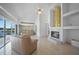 Bright living room features a fireplace, tile floors, modern ceiling fan, and view of the pool and canal at 341 Segovia Dr, Punta Gorda, FL 33950
