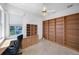 A home office space with built in desk and shelving, as well as tile floors at 341 Segovia Dr, Punta Gorda, FL 33950