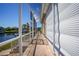 Brick patio extends along the canal and features a screened enclosure at 341 Segovia Dr, Punta Gorda, FL 33950