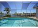Screened pool overlooks a picturesque canal, providing a tranquil and private outdoor space at 341 Segovia Dr, Punta Gorda, FL 33950