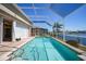 Inviting screened pool is perfect for cooling off and enjoying the beautiful canal views at 341 Segovia Dr, Punta Gorda, FL 33950