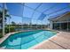 Sparkling screened pool with a serene canal view offers the ultimate Florida lifestyle at 341 Segovia Dr, Punta Gorda, FL 33950