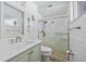 Bathroom with a vanity, toilet, and tile shower with glass doors at 4114 Yucatan Cir, Port Charlotte, FL 33948