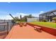 Dock seating area with canal access and lush landscaping at 4114 Yucatan Cir, Port Charlotte, FL 33948