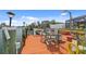 Dock overlooking canal with outdoor seating, table and lush landscaping at 4114 Yucatan Cir, Port Charlotte, FL 33948