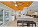 Spacious eat-in kitchen featuring an island with seating, white cabinets and countertops at 4114 Yucatan Cir, Port Charlotte, FL 33948