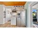 Kitchen featuring stainless steel refrigerator, built-in microwave, and pantry at 4114 Yucatan Cir, Port Charlotte, FL 33948