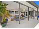Covered patio with ceiling fan, outdoor furniture, potted plants and open view at 4114 Yucatan Cir, Port Charlotte, FL 33948