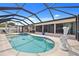 Private screened-in pool featuring a tranquil oasis with serene blue waters at 4114 Yucatan Cir, Port Charlotte, FL 33948