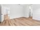 This is an airy bedroom with wood-look flooring and bright, neutral paint at 5110 Burri Ct, North Port, FL 34288