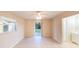 Bright bedroom with sliding glass door access to the backyard and a nearby private bathroom at 536 Lakehurst Nw Ave, Port Charlotte, FL 33952