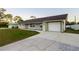 Charming single-story home with a freshly painted exterior, attached garage, and well-manicured lawn at 536 Lakehurst Nw Ave, Port Charlotte, FL 33952