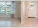 Bright living room with tile flooring and ample natural light from large windows at 536 Lakehurst Nw Ave, Port Charlotte, FL 33952