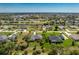 Aerial view of a home near a lake with clearly marked property lines at 619 Boundary Blvd, Rotonda West, FL 33947