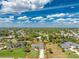 An aerial view of property lines for a home with a big lawn and a treeline in the distance at 619 Boundary Blvd, Rotonda West, FL 33947