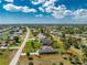 Aerial view of a home with an adjacent canal and clearly marked property lines at 619 Boundary Blvd, Rotonda West, FL 33947