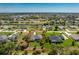 Aerial view of a home near a lake with clearly marked property lines at 619 Boundary Blvd, Rotonda West, FL 33947