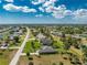 Aerial view of a home with an adjacent canal and clearly marked property lines at 619 Boundary Blvd, Rotonda West, FL 33947