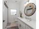 Bathroom featuring vanity with modern fixtures, toilet, and shower with curtain at 619 Boundary Blvd, Rotonda West, FL 33947