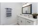 Bright bathroom featuring a vanity with a mirror and a towel rack at 619 Boundary Blvd, Rotonda West, FL 33947