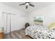 Cozy bedroom with wood-look floors and a ceiling fan for added comfort at 619 Boundary Blvd, Rotonda West, FL 33947