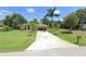 Beautiful home with well-maintained landscaping and an inviting entrance at 619 Boundary Blvd, Rotonda West, FL 33947