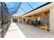 Large screened lanai offers beautiful backyard views and great seating options at 619 Boundary Blvd, Rotonda West, FL 33947