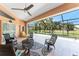 Screened lanai offers ample seating with great views of the backyard at 619 Boundary Blvd, Rotonda West, FL 33947
