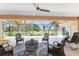 Screened lanai offers ample seating with great views of the backyard at 619 Boundary Blvd, Rotonda West, FL 33947