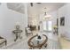 Bright open concept living room featuring neutral paint, high ceilings, decorative accents, and dining room view at 619 Boundary Blvd, Rotonda West, FL 33947