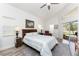 Serene main bedroom with a comfortable bed, wood-look floors, and plenty of natural light at 619 Boundary Blvd, Rotonda West, FL 33947
