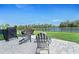 Outdoor patio featuring seating with a beautiful view of the pond and surrounding nature at 6315 164Th E Ave, Parrish, FL 34219