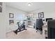 Bright bedroom with a Peloton bike, cozy carpet, lots of natural light and comfortable workspace at 6315 164Th E Ave, Parrish, FL 34219