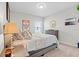 This bedroom includes a window view, a bed, and a dresser at 6315 164Th E Ave, Parrish, FL 34219