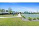 View of the community playground and basketball court with lush green surroundings on a bright and sunny day at 6315 164Th E Ave, Parrish, FL 34219