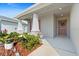 Welcoming front porch with decorative plants and wreath on the front door at 6315 164Th E Ave, Parrish, FL 34219