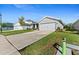A single-story home with well-kept landscaping and an attached two-car garage at 6315 164Th E Ave, Parrish, FL 34219