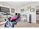 Bright home office featuring artwork, desk, exercise bike and natural light at 6315 164Th E Ave, Parrish, FL 34219
