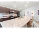 Modern kitchen featuring granite countertops, stainless steel appliances, and ample counter space at 6315 164Th E Ave, Parrish, FL 34219