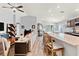 Open-concept living area featuring modern decor and a spacious kitchen with a large granite island at 6315 164Th E Ave, Parrish, FL 34219