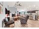 Bright living room showcasing vaulted ceilings, wood-look flooring, and an open-concept design at 6315 164Th E Ave, Parrish, FL 34219
