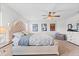 Spacious bedroom featuring a decorative bedframe, ceiling fan and comic book art adorning the walls at 6315 164Th E Ave, Parrish, FL 34219
