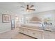 Serene main bedroom features plush carpet, ceiling fan, and en-suite bathroom at 6315 164Th E Ave, Parrish, FL 34219